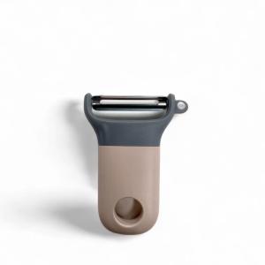 Eplucheur économe avec lame inox  11x8 cm Rose