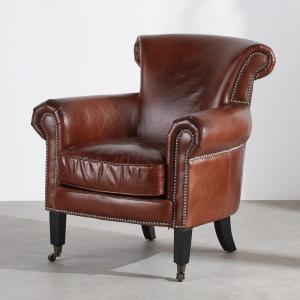 Fauteuil en cuir marron effet vieilli