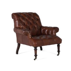 Fauteuil rembourré en cuir avec accoudoirs capitonnés