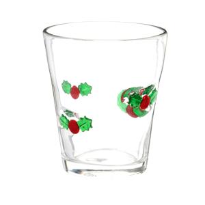 Gobelet en verre et houx rouges et verts