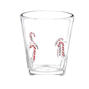 Gobelet en verre et sucres d'orge rouges et blancs